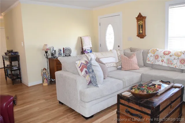 a view of a dining room with furniture and a window