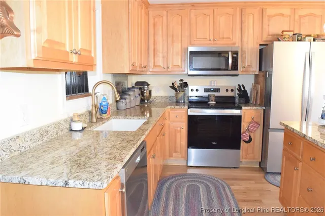 a bedroom with a bed and a television