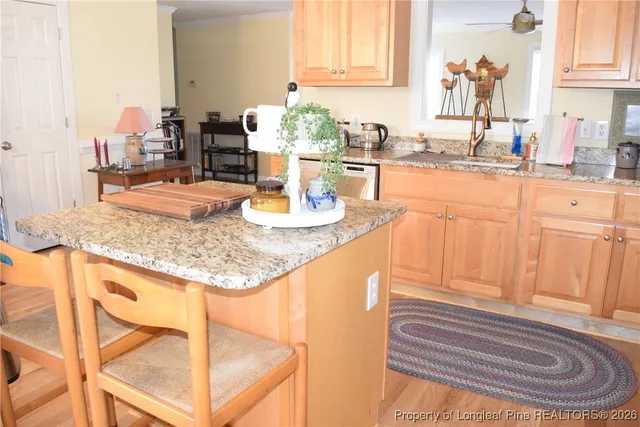 a view of walk in closet with clothes