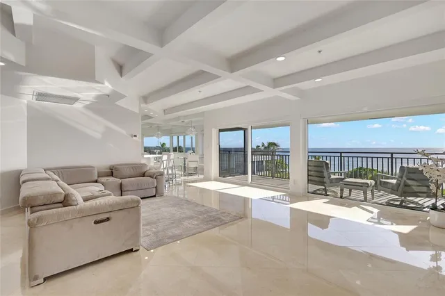 a bedroom with a large bed and a lamp