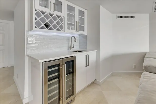 a spacious bedroom with a bed and a mirror