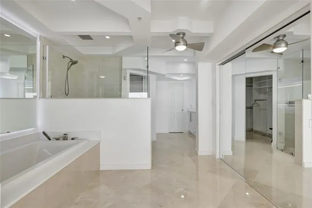 a bathroom with a shower and a sink