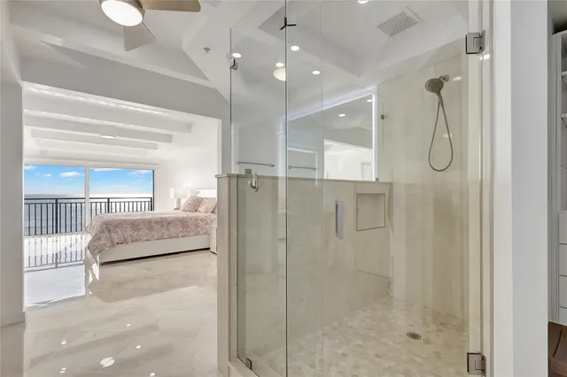 a bedroom with a bed and a night stand