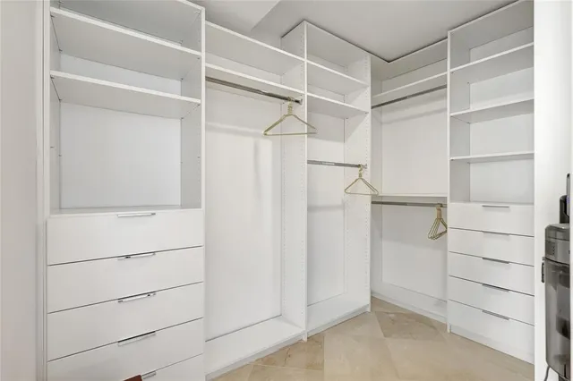 a bedroom with a bed and a lamp