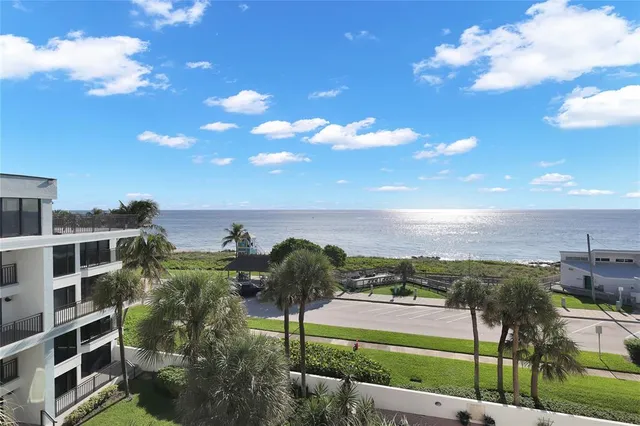 a view of a yard with an ocean view