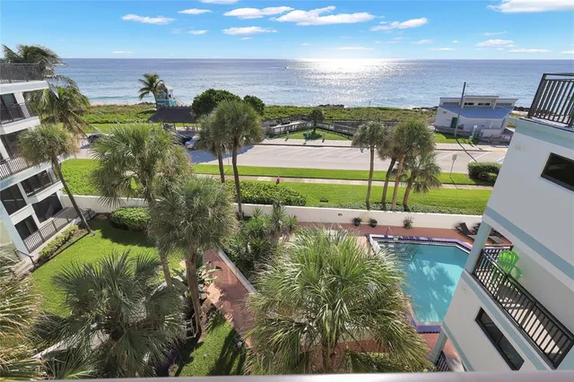 a view of a swimming pool with a yard