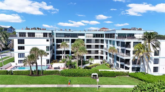 swimming pool view with a seating space