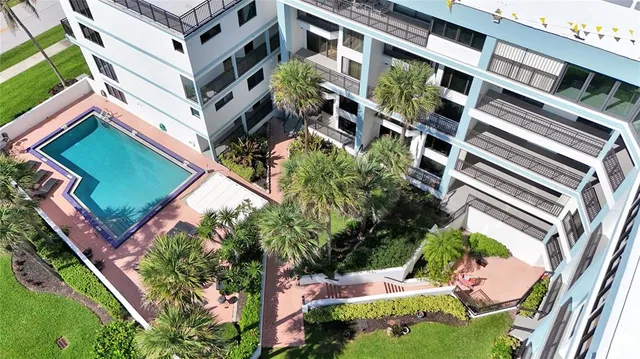 a view of a sign board with a bunch of plants