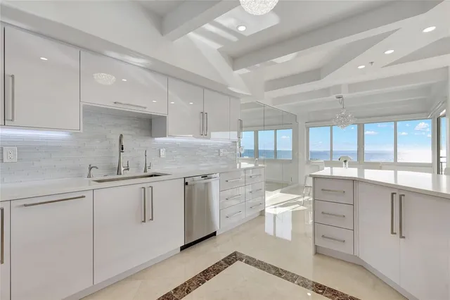 a view of a dining room with furniture a chandelier and wooden floor