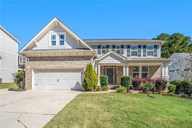 front view of a house with a yard