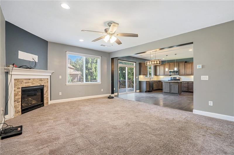 115 Floating Leaf Way Dallas, GA 30132 - Photo 11 of 49 a view of an empty room with a fireplace and a window