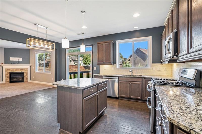 115 Floating Leaf Way Dallas, GA 30132 - Photo 15 of 49 a kitchen with stainless steel appliances granite countertop a stove and a refrigerator