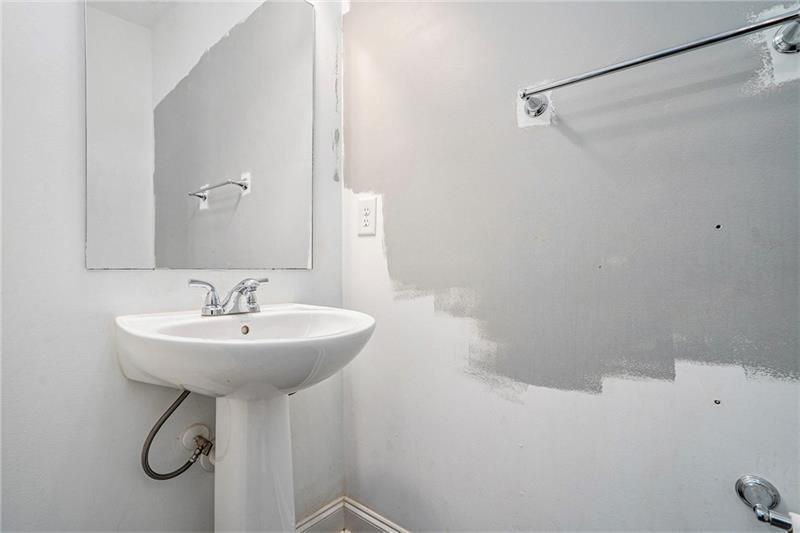 115 Floating Leaf Way Dallas, GA 30132 - Photo 16 of 49 a bathroom with a sink a toilet and a mirror