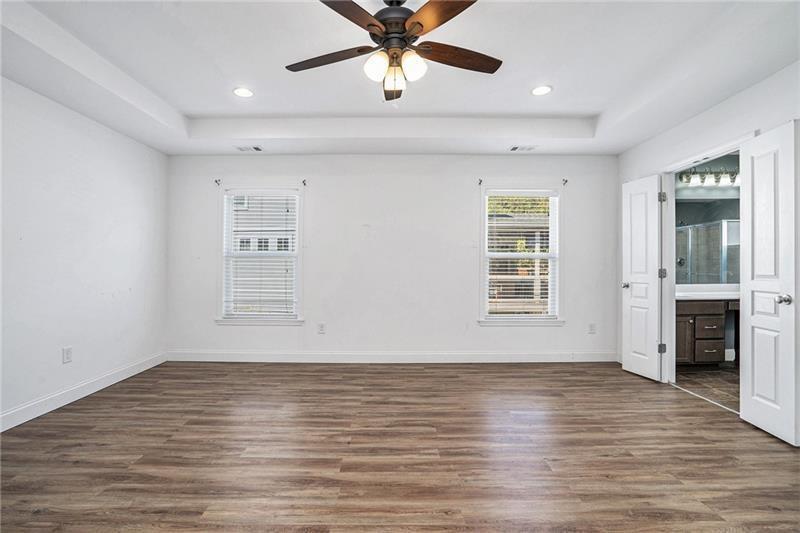 115 Floating Leaf Way Dallas, GA 30132 - Photo 20 of 49 wooden floor in an empty room with a window