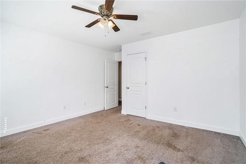 115 Floating Leaf Way Dallas, GA 30132 - Photo 29 of 49 an empty room with closet and a chandelier fan