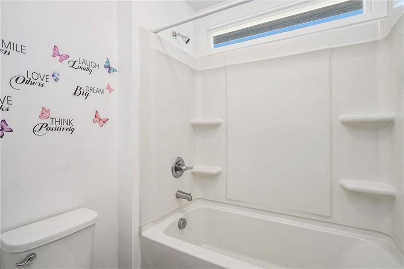 115 Floating Leaf Way Dallas, GA 30132 - Photo 31 of 49 a bathroom with a bathtub and a toilet