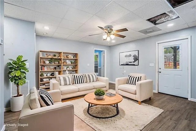 a living room with furniture and a rug