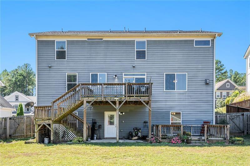 115 Floating Leaf Way Dallas, GA 30132 - Photo 46 of 49 a view of a house with wooden stairs and a small yard