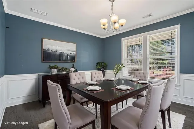 a view of a dining room with furniture window and outside view