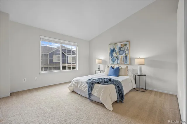 a bed room with a bed and a window