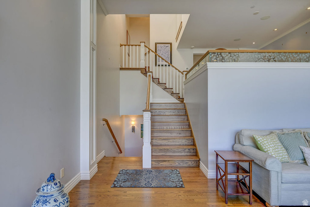9699 Bypass Road, Unit 5 Alta, UT 84092 - Photo 17 of 54 Hardwood staircase with white balusters and natural wood handrails