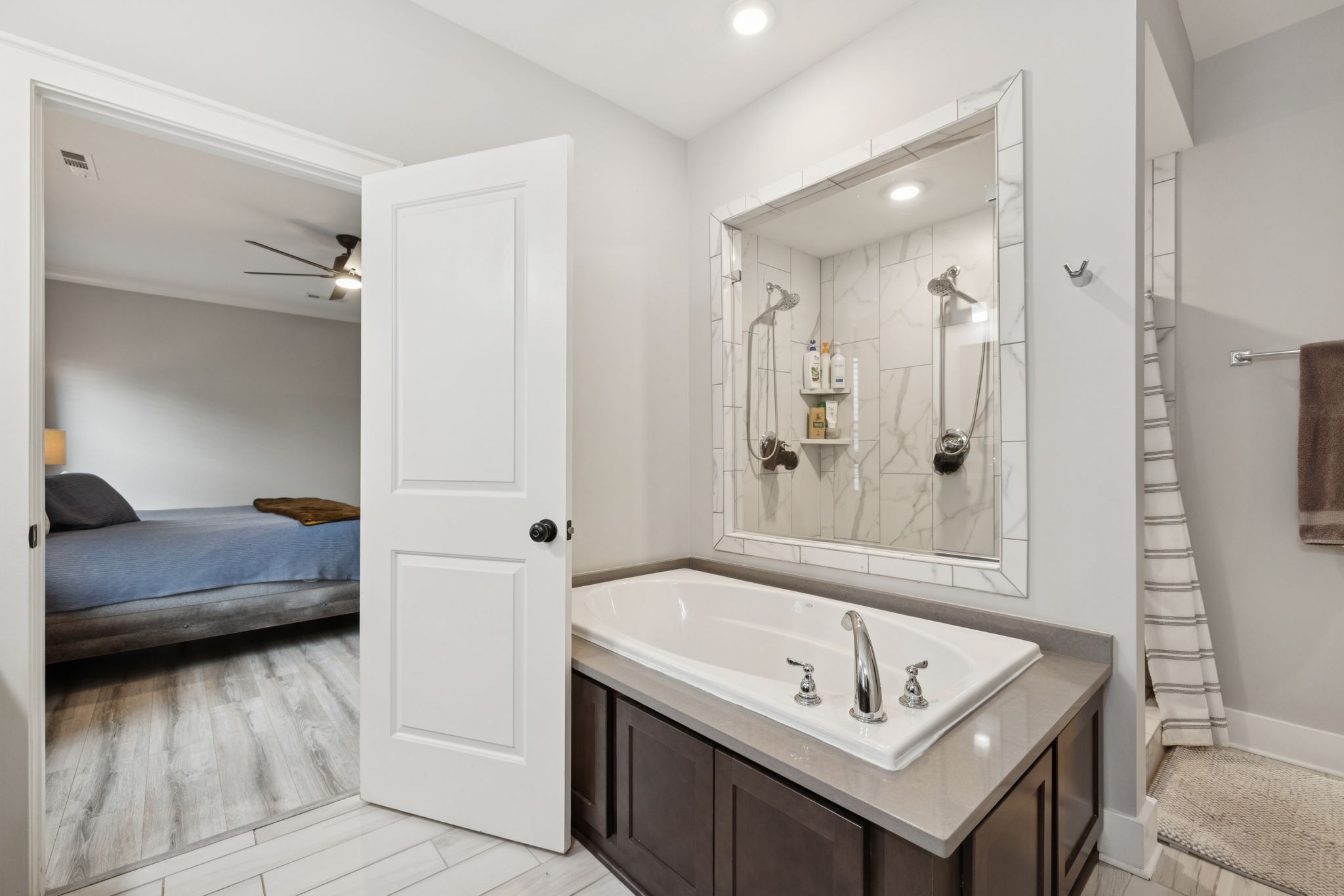 247 Croft Way Mount Juliet, TN 37122 - Photo 30 of 66 a bathroom with a tub sink and mirror