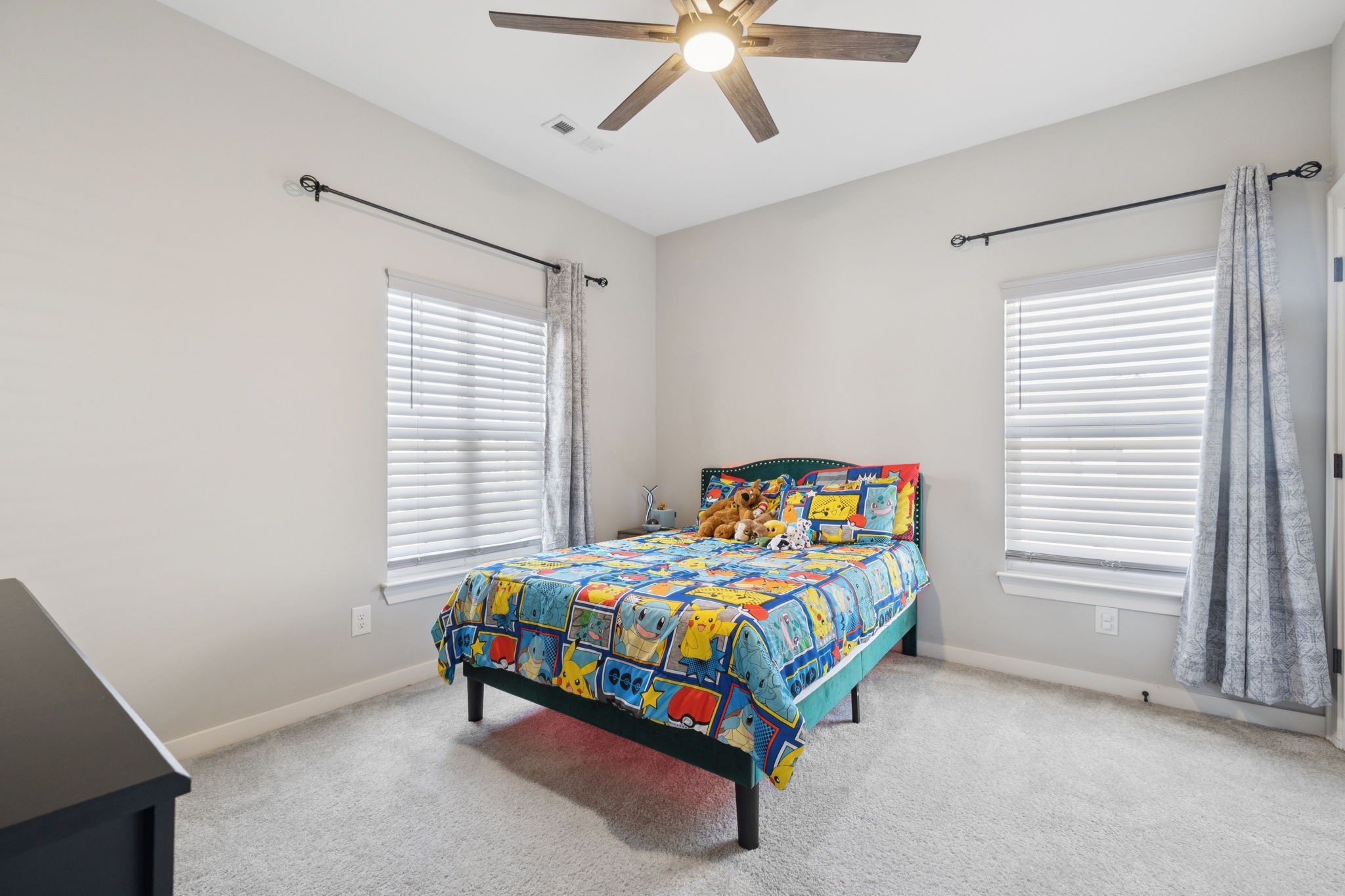 247 Croft Way Mount Juliet, TN 37122 - Photo 44 of 66 a bedroom with a bed and a chandelier