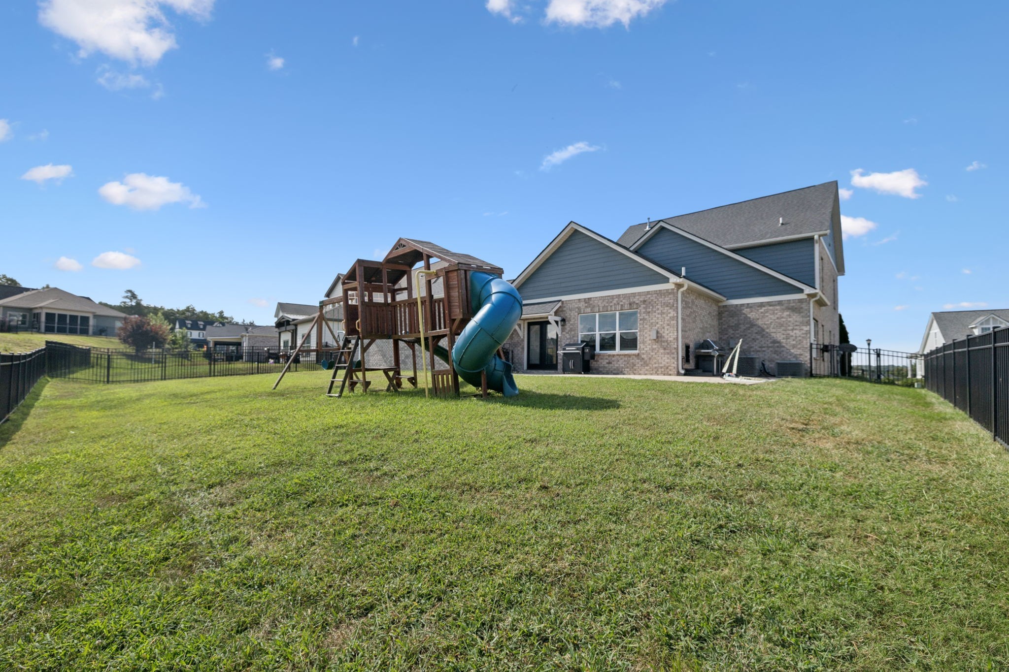 247 Croft Way Mount Juliet, TN 37122 - Photo 57 of 66 a view of a big house with a big yard and potted plants