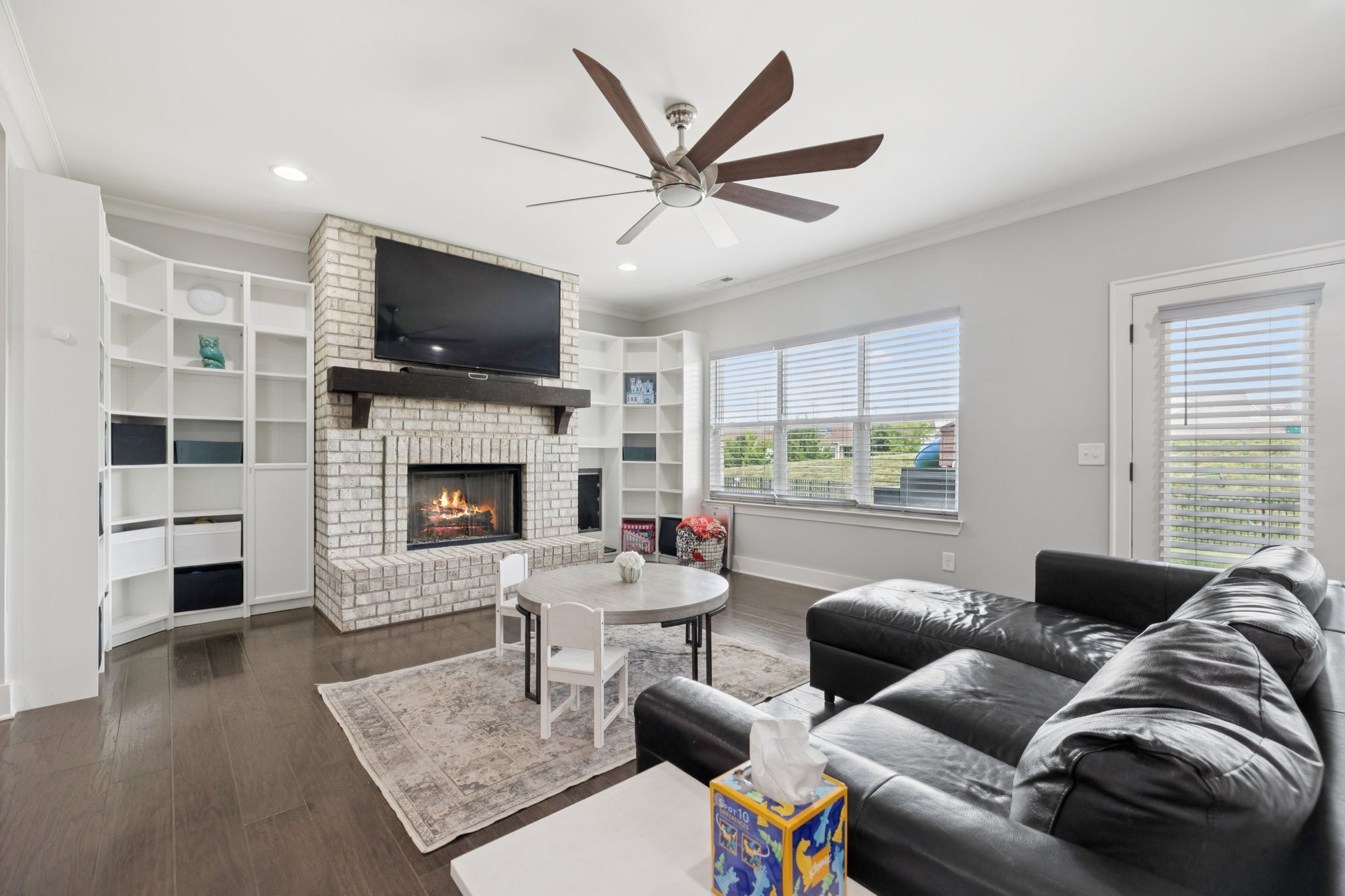 247 Croft Way Mount Juliet, TN 37122 - Photo 6 of 66 a living room with furniture a flat screen tv and a fireplace