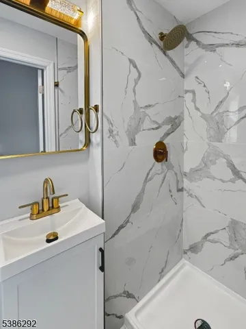 a bathroom with a sink and a shower