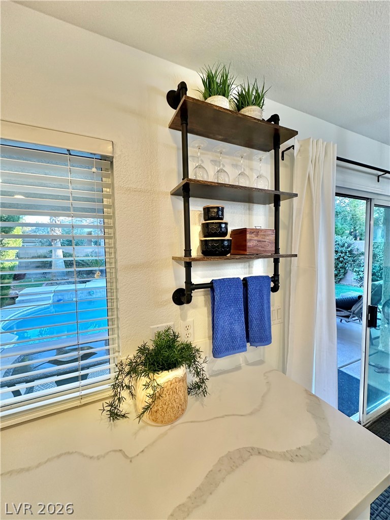 10263 Splendor Ridge Avenue Las Vegas, NV 89135 - Photo 20 of 55 MODERN SHELVING IN KITCHEN.