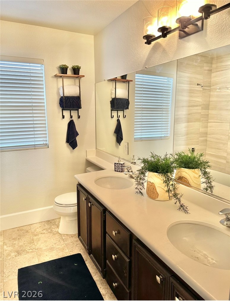 10263 Splendor Ridge Avenue Las Vegas, NV 89135 - Photo 39 of 55 KIDS BATH WITH DUAL SINKS AND NEW TILE.