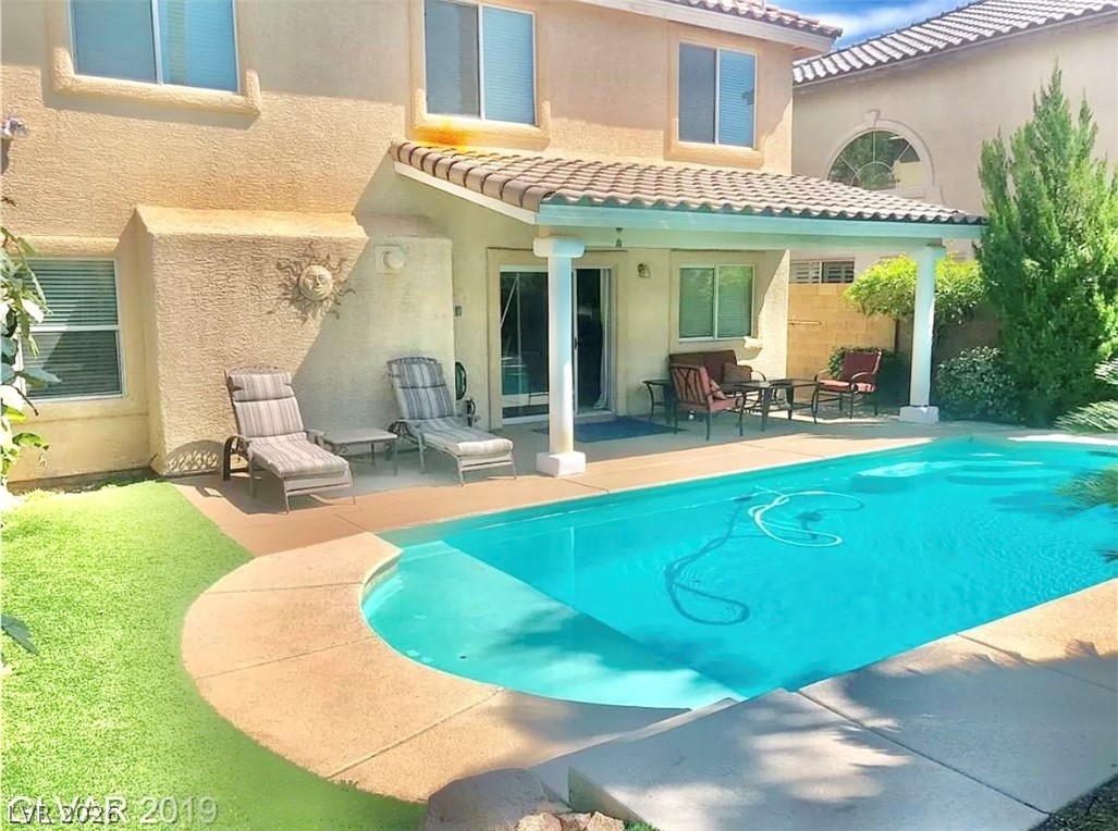 10263 Splendor Ridge Avenue Las Vegas, NV 89135 - Photo 49 of 55 Spacious covered patio and you can hook up a TV here.