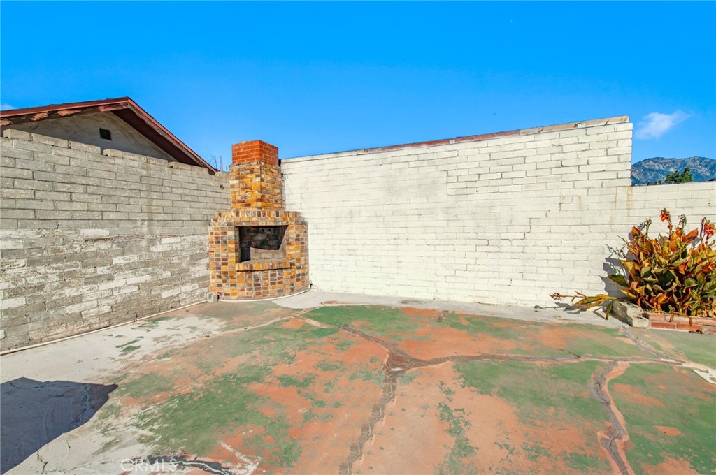 1885 West 9th Street Upland, CA 91786 - Photo 38 of 41 a front view of a house with a yard