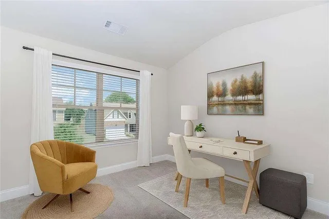 a workspace with furniture and a window