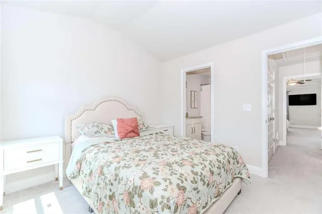 a bedroom with a bed and a mirror