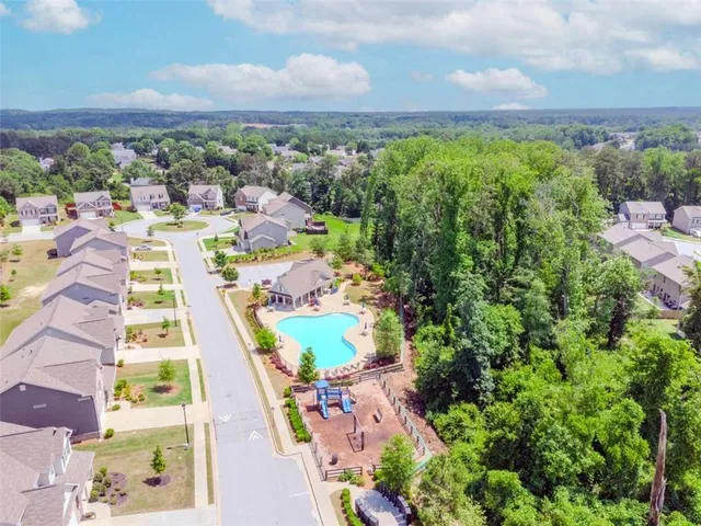 a view of a backyard with sitting area