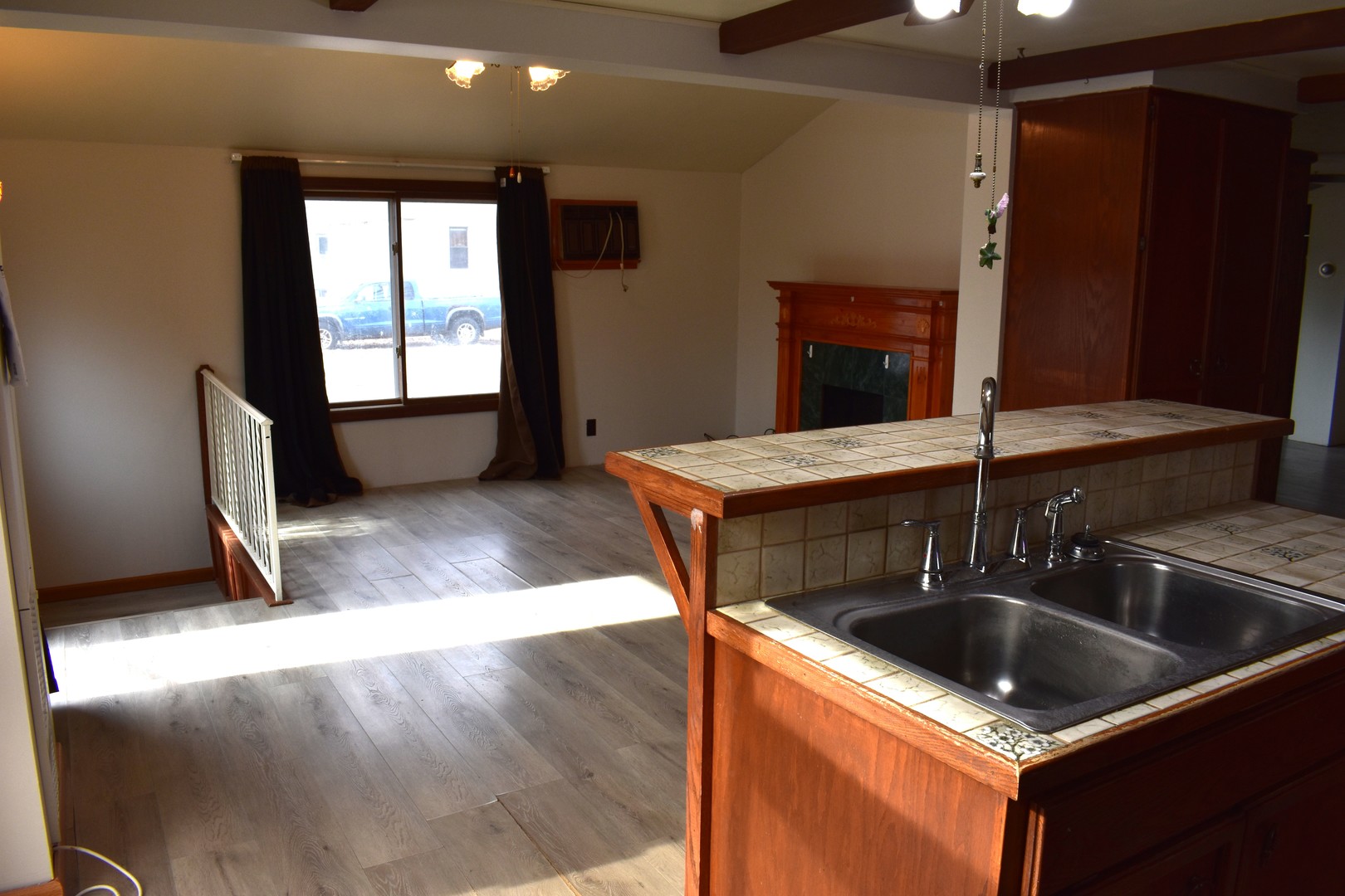 702 East Timber Street Pontiac, IL 61764 - Photo 13 of 25 a kitchen that has a sink and a stove in it