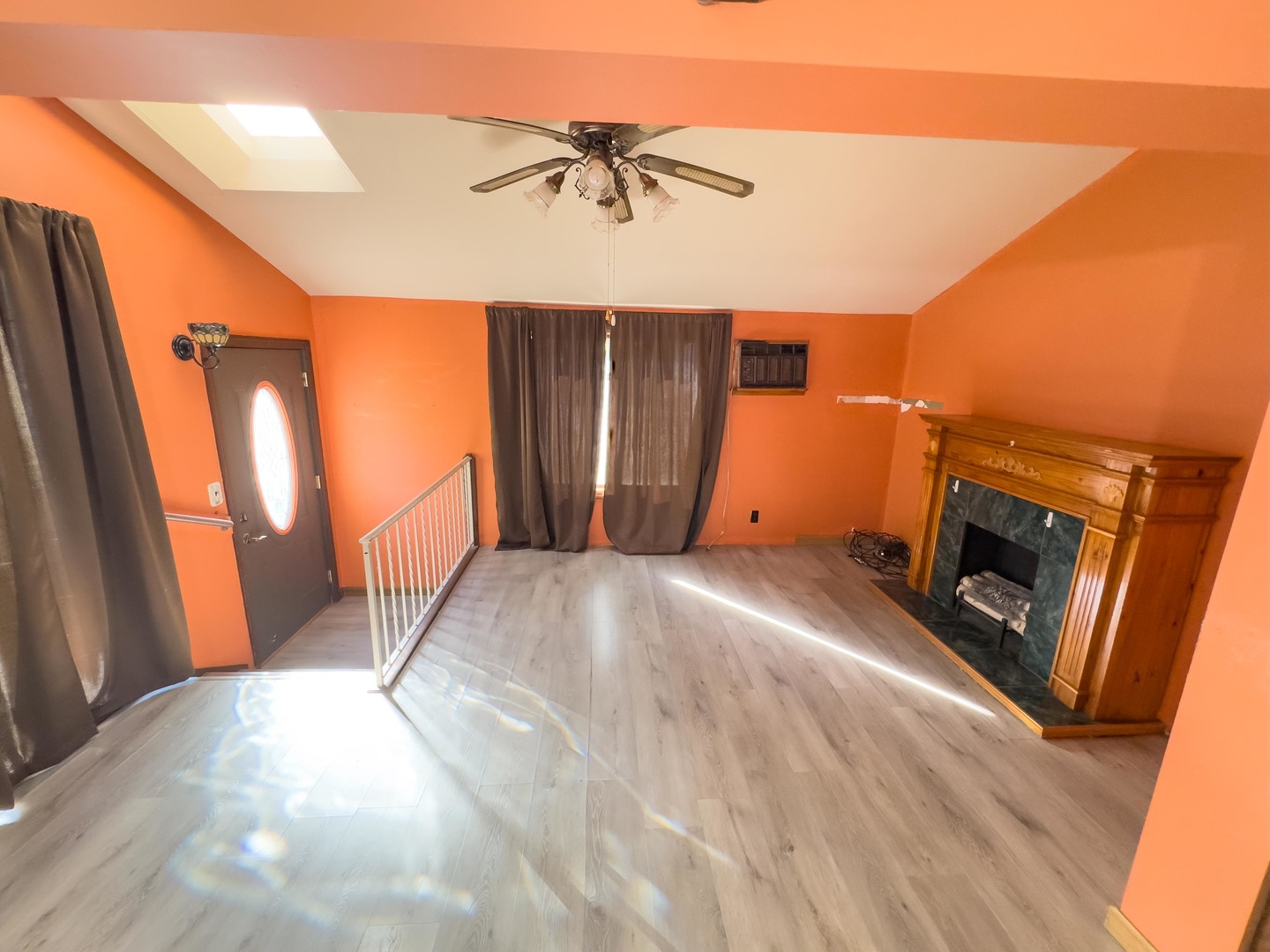 702 East Timber Street Pontiac, IL 61764 - Photo 13 of 24 a view of empty room with a fireplace and wooden floor