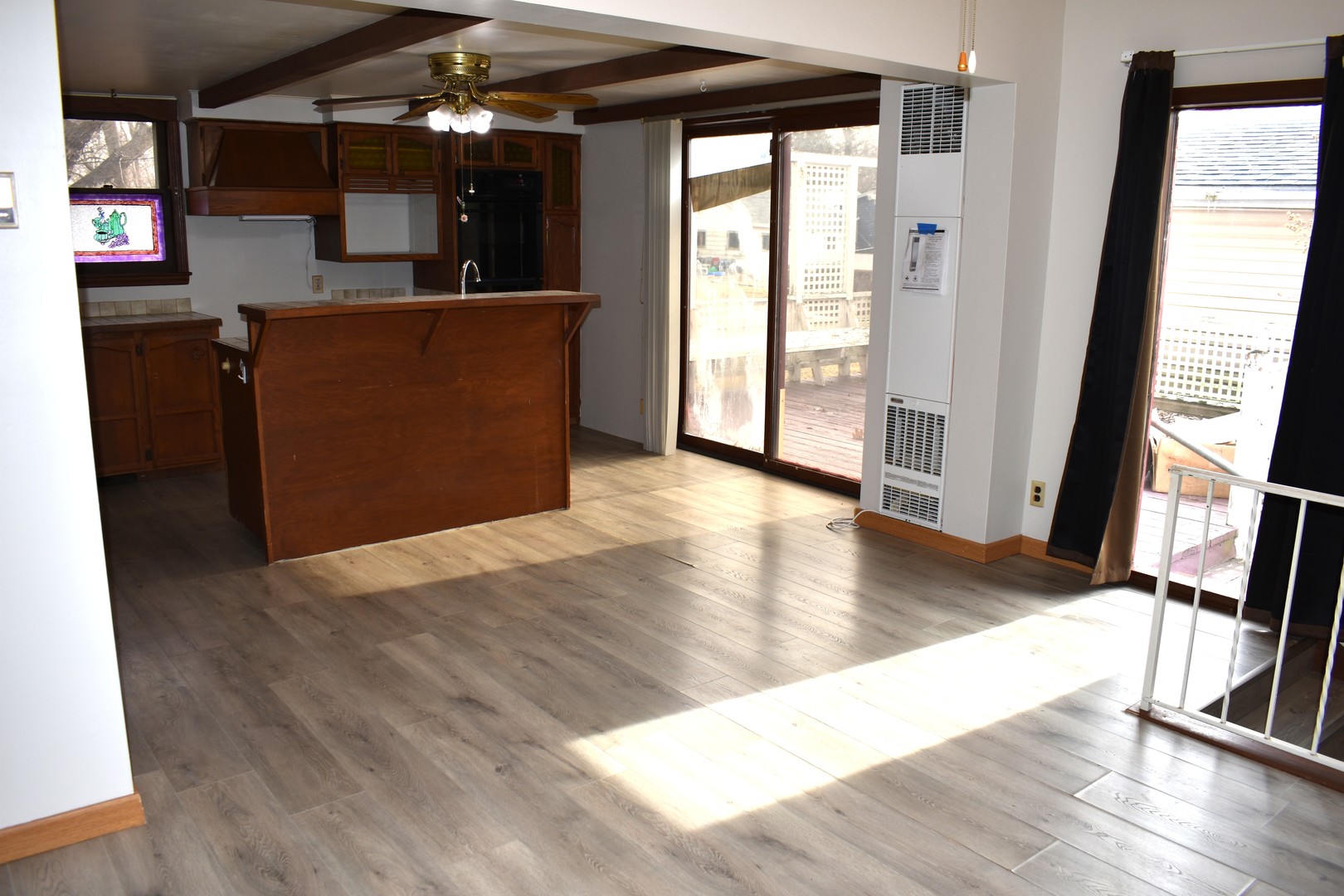 702 East Timber Street Pontiac, IL 61764 - Photo 14 of 25 wooden floor in an empty room with a window