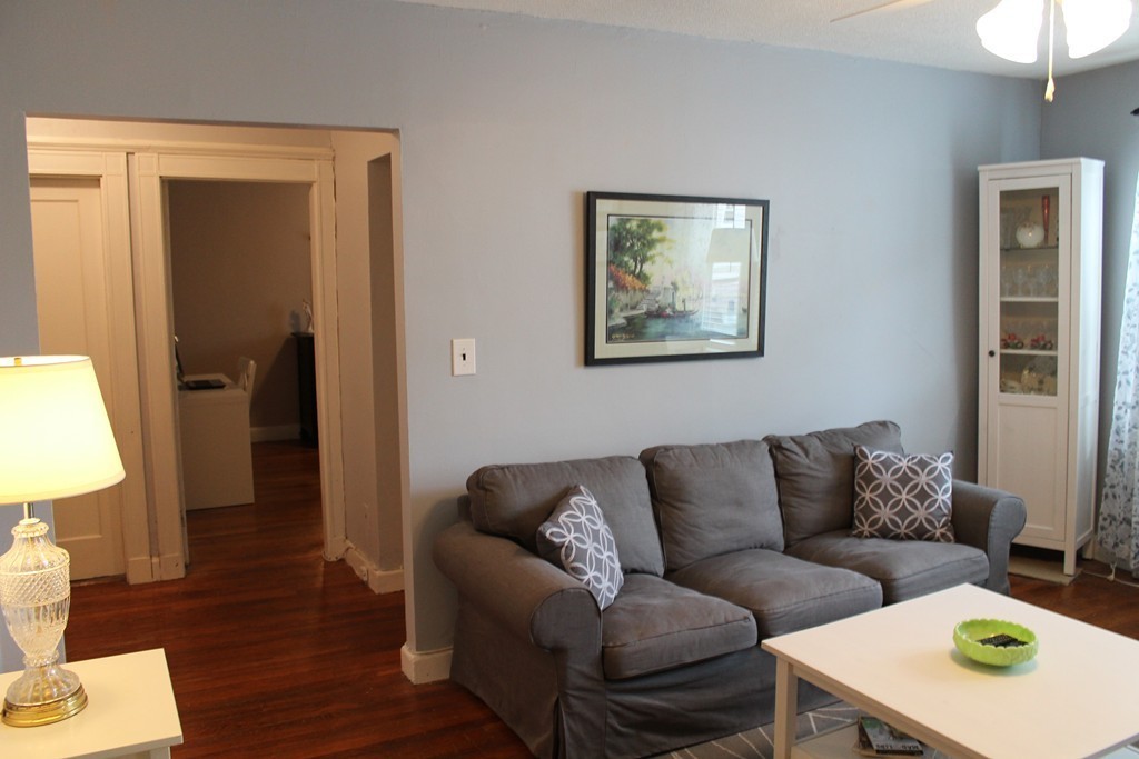 8 Walnut Street, Unit 24 Everett, MA 02149 - Photo 3 of 14 a living room with furniture and a window