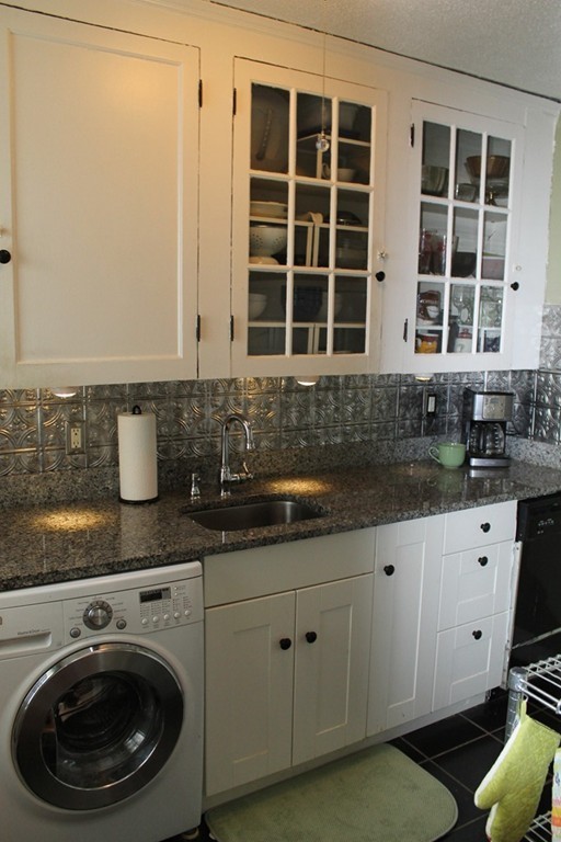 8 Walnut Street, Unit 24 Everett, MA 02149 - Photo 6 of 14 a kitchen with a sink and cabinets