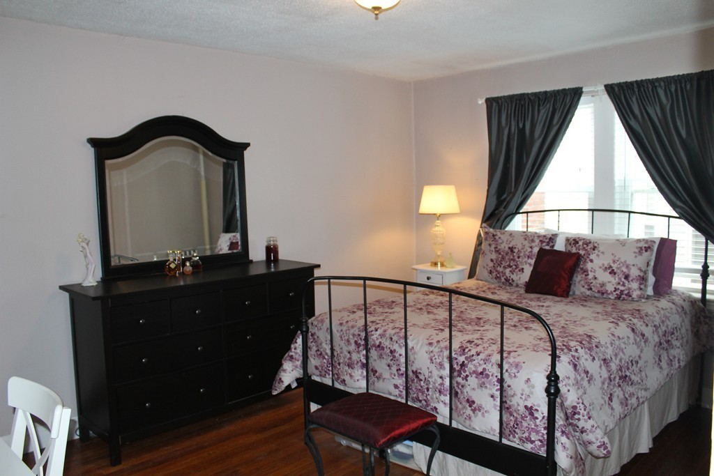 8 Walnut Street, Unit 24 Everett, MA 02149 - Photo 7 of 14 a bedroom with a bed and a window