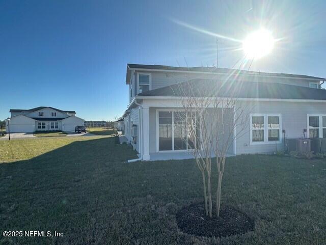 156 Camphor Laurel Road St. Augustine, FL 32092 - Photo 27 of 34 a view of a house with backyard sitting area and garden