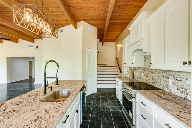 a kitchen with a sink and cabinets