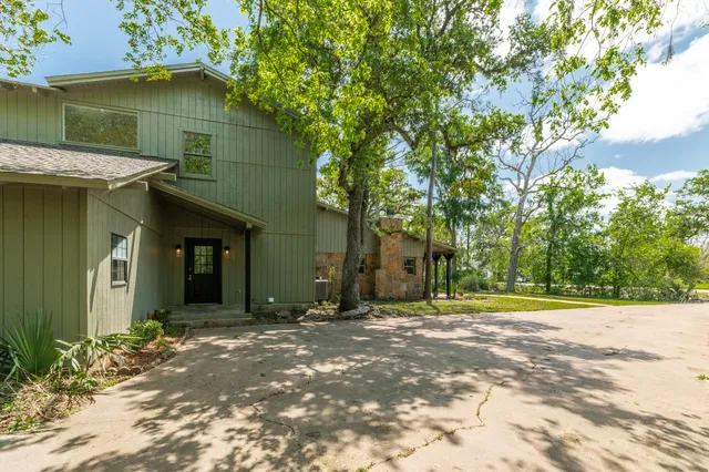 a backyard of a house with lots of green space