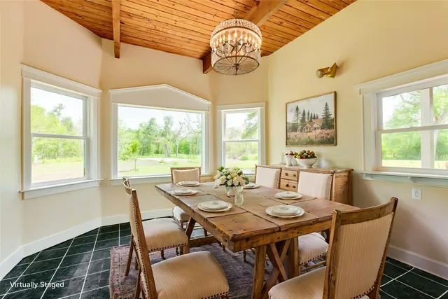 a view of a dining room with furniture window and outside view