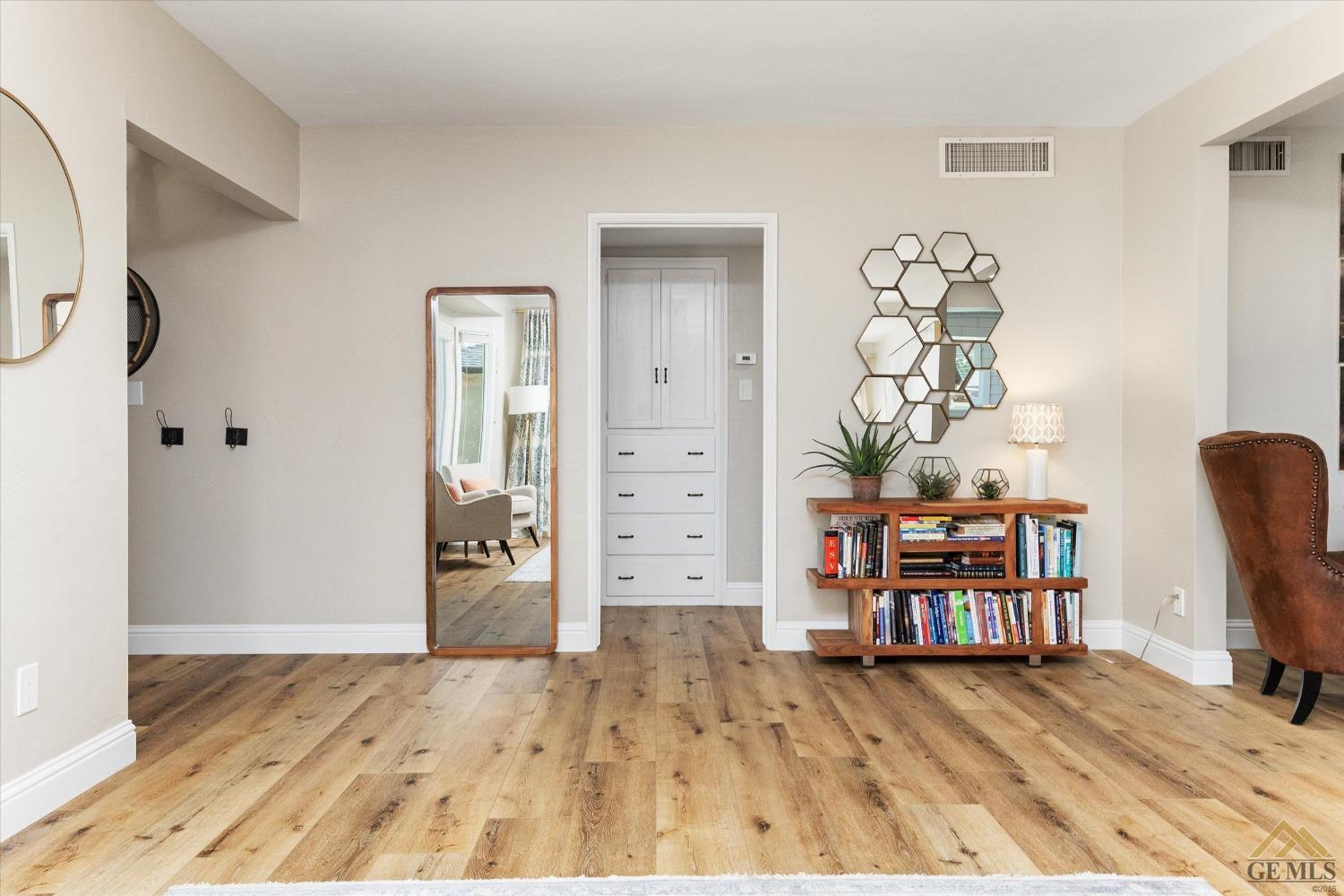 Undisclosed Address Bakersfield, CA 93305 - Photo 11 of 41 a view of a bedroom with wooden floor and closet