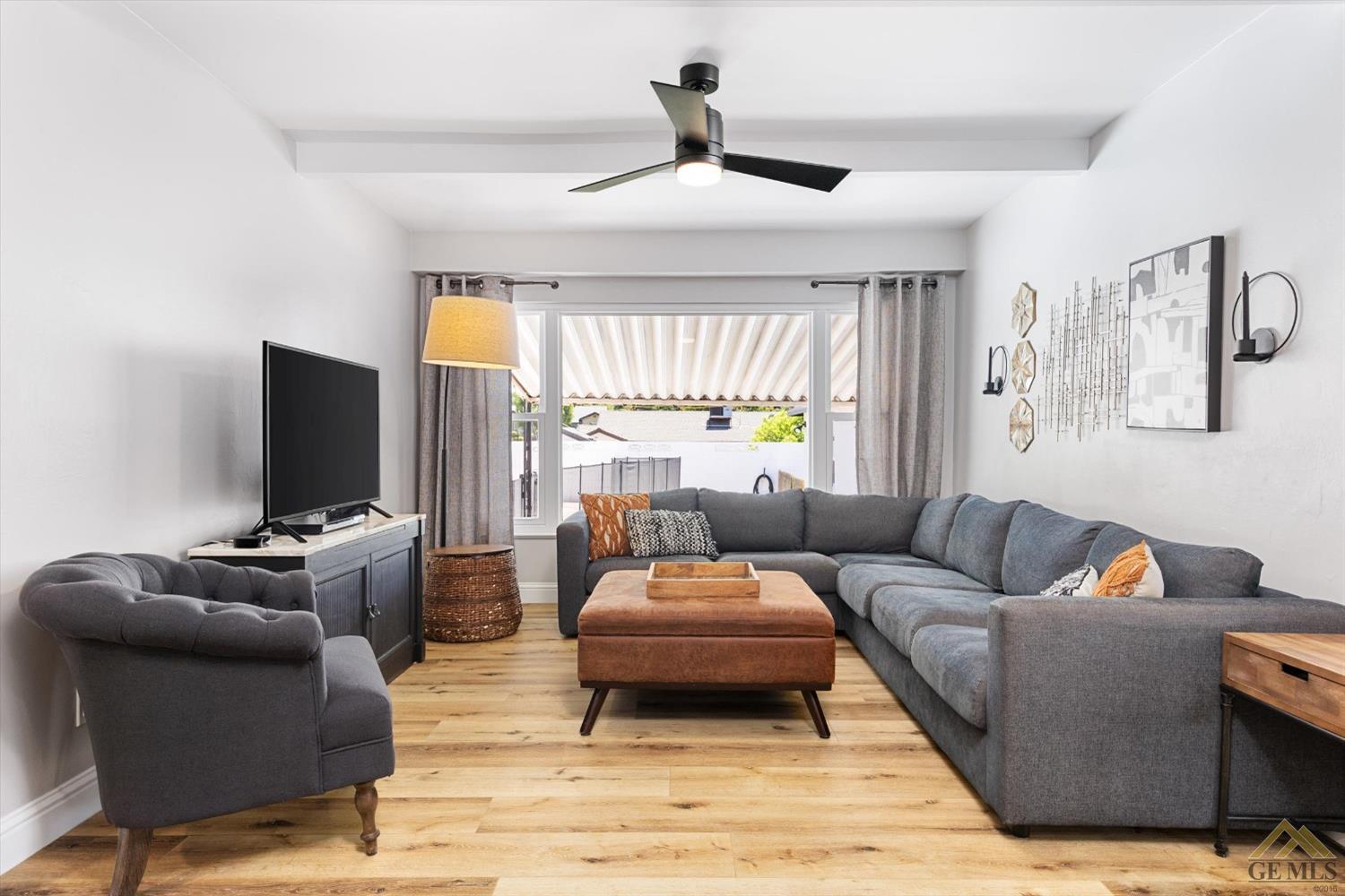 Undisclosed Address Bakersfield, CA 93305 - Photo 15 of 41 a living room with furniture and a flat screen tv