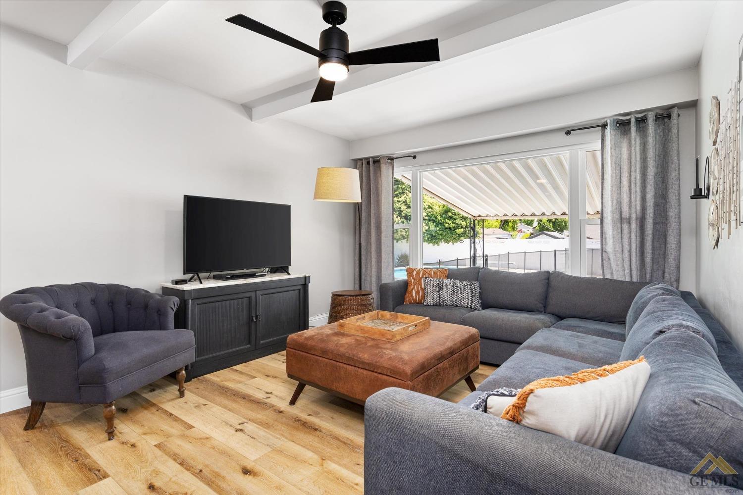 Undisclosed Address Bakersfield, CA 93305 - Photo 16 of 41 a living room with furniture and a flat screen tv